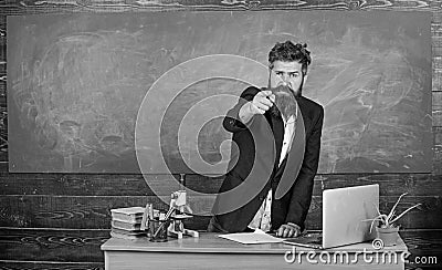 Talking to students or pupils. Teacher bearded man tell interesting story. Teacher charismatic hipster stand near table Stock Photo