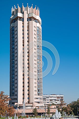 Tall building with crown hotel Kazakhstan against the vivid blue sky in Almaty Editorial Stock Photo