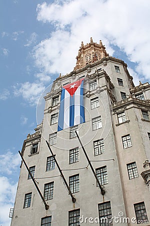 Tall building with a cuban flag Stock Photo