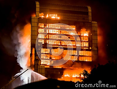 Tall building on fire / big fires burnning Stock Photo