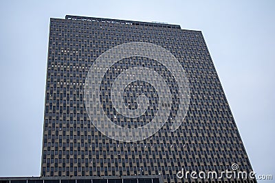 a tall building with lots of windows near the sky line Editorial Stock Photo