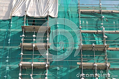 Tall Building in Scaffolding Stock Photo