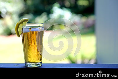 Iced Tea on balcony with Lemon Slice Stock Photo