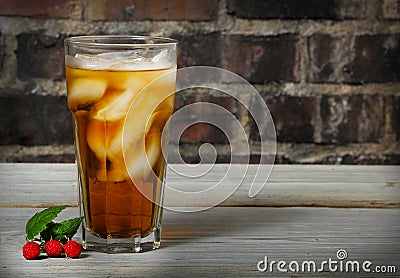 Tall cold glass of raspberry ice tea Stock Photo