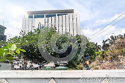 A tall, cream-colored building located in a campus office complex Editorial Stock Photo