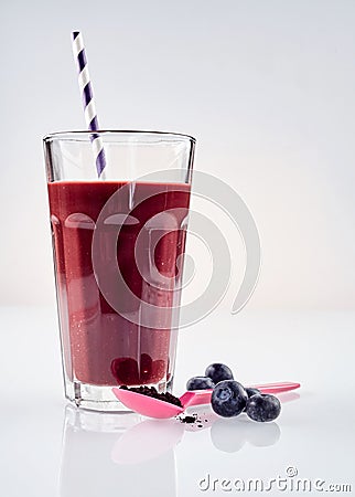 Tall glass of blueberry and acai smoothie Stock Photo