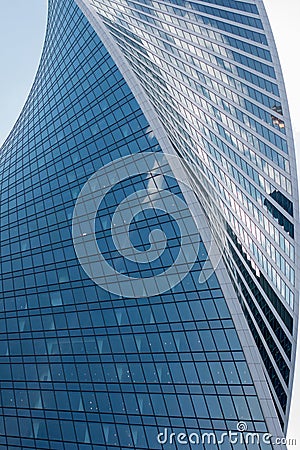 A tall glass business building with large windows. Editorial Stock Photo