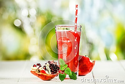 Tall glass of delicious pomegranate juice Stock Photo