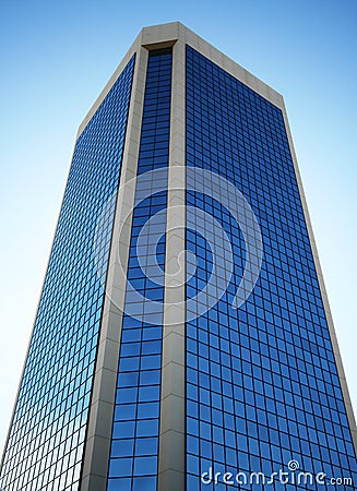 A Tall Glass Tower Reflects the Sky Stock Photo