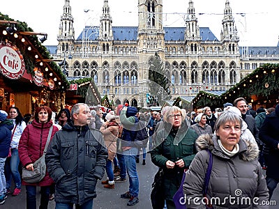 Tall gothic building of Vienna city hall Rathaus and traditional Christmas market Editorial Stock Photo