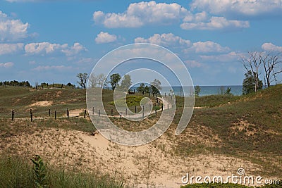 Tall grasses growing on hills of sand dunes, along the Kohler Dunes Cordwalk Trail, in front of Lake Michigan in Wisconsin Stock Photo