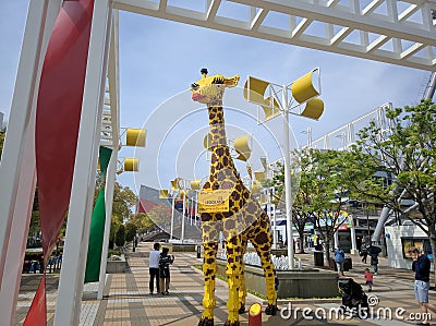 Tall Lego giraffe stands on a street in Osaka, Japan Editorial Stock Photo