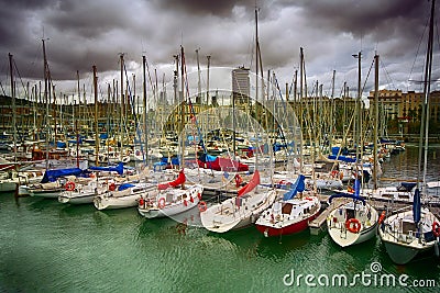 Tall luxury boats and yachts moored in duquesa Port In Spain. Barcelona Stock Photo