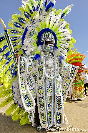 A tall male celebrant is dressed in Indian garb on Carnival Day in Trinidad Editorial Stock Photo