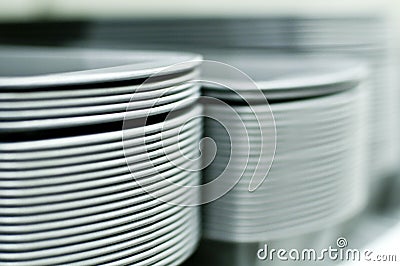 Tall Stacks of White Plates Stock Photo