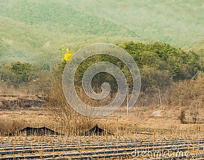 Tall statue of golden buddha Stock Photo