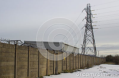 A tall steel electricity pylon with high voltage power cables that is part of the local grid supply network Editorial Stock Photo