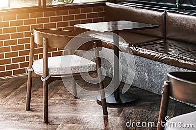 Tall table - Wooden table steel legs simplistic, tall bar stools in stylish kitchen with wooden cupboards. Stock Photo