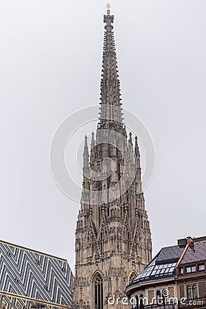 Tall tower of St. Stephen`s Cathedral, the mother church of the Roman Catholic Archdiocese of Vienna and the seat of the Stock Photo