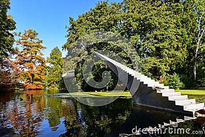 Tall tree with orange and yellow leaves in autumn, in Christchurch Botanic Gardens Stock Photo