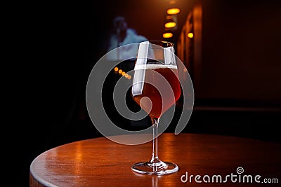 Tall tulip glass full in the bar Stock Photo