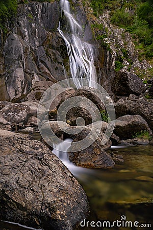 Tall waterfall cascading over igneous rock - Aber Falls, North Wales Stock Photo