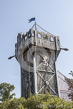 Tall wooden play climbing castle with flag and climbing bridge a Gathering Place public park in Oklahoma Editorial Stock Photo