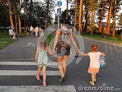 Tallinn, Esntonia - 09.2019: mother taking the children across the street Editorial Stock Photo