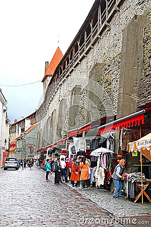 Hellemann tower and open-air market near old wall, Tallinn, Estonia Editorial Stock Photo