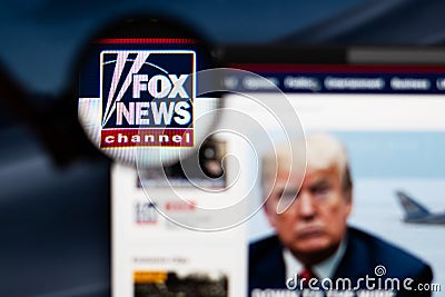 Fox News Channel logo visible through a magnifying glass. Editorial Stock Photo