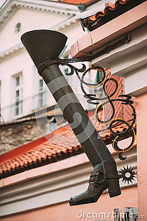 Tallinn, Estonia. Gutter In The Shape Of A Long Boot On The Long Leg Street Or Pikk Jalg Stock Photo