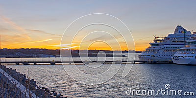 Tallinn, Estonia -march 05, 2022: AIDA Cruise ship at sunset time in harbour. AIDA luxury liner at wonderful evening Editorial Stock Photo