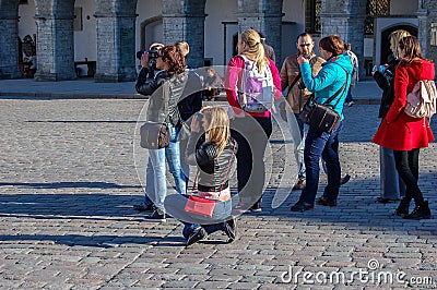 Tallinn, Estonia 02 may 2017. Tourists photographers on the square in the old city Editorial Stock Photo