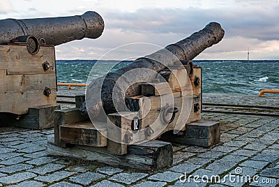 Tallinn, Estonia - November 18, 2018: Old cannons in the Maritime Museum of Tallinn. Cannon on wooden gun carriages Editorial Stock Photo