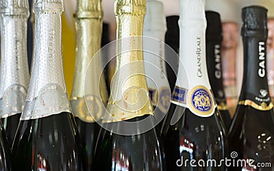 Tallinn Estonia - November 5th 2016: Cinzano gold, silver, white and black champagne bottles necks top caps at standing Editorial Stock Photo