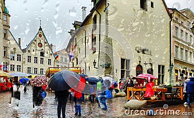 Tallinn Estonia rainy street people walking umbrellas travel to Europe tourist autumn street cafe town square coffee table old t Editorial Stock Photo