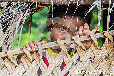 TAMAN NEGARA, MALAYSIA - MARCH 17, 2018: Indigenous baby in a village in Taman Negara national park, Malays Editorial Stock Photo