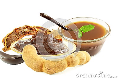 Tamarind with tamarind water juice concentrate chutney pulp or paste on white background Stock Photo
