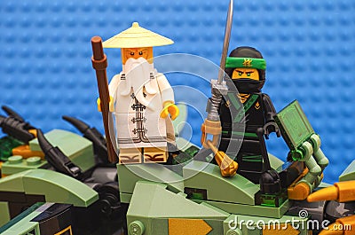 Lego Ninjago Movie. The Green Ninja and Wu standing on Green Ninja Mech Dragon and ready to battle Editorial Stock Photo