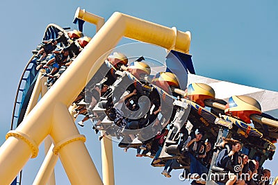 People ride giant Montu Roller Coaster at Bush Gardens Tampa Bay . Several are screaming. Editorial Stock Photo