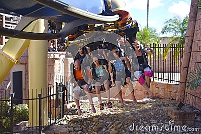 Funny people starting terrifying trip in Montu Rollercoaster at Bush Gardens Editorial Stock Photo