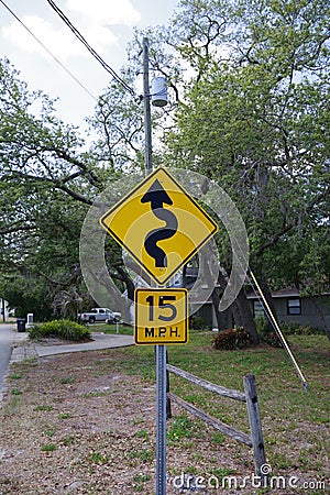 Tampa, Florida / USA - May 5 2018: 15 MPH low angle street sign with the symbol of a squiggly line Editorial Stock Photo