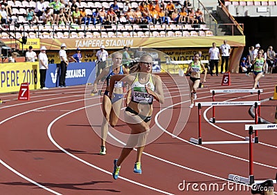 Sylvia SCHULZ and Brooke JAWORSKI running 400 meters hurdles heats on the IAAF World U20 Championship Editorial Stock Photo