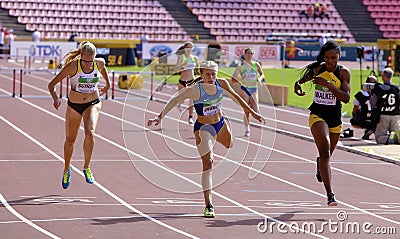 Sylvia SCHULZ, Brooke JAWORSKI and Sanique WALKER running 400 meters hurdles heats on the IAAF World Editorial Stock Photo