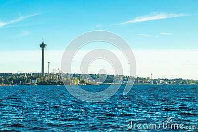 Tampere, Finland - 24 June 2019: Sarkanniemi amusement park with Nasinneula tower, view over the water at sunset Editorial Stock Photo
