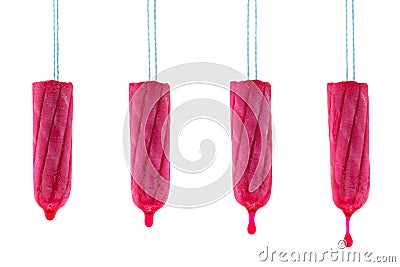 Tampon hanging with dripping red syrup liquid drop that looks li Stock Photo