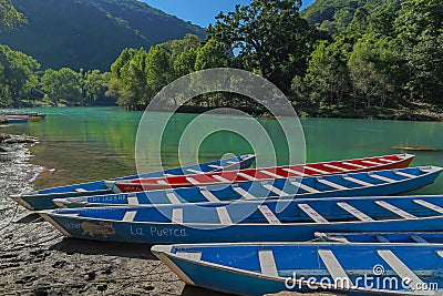 TAMUL, SAN LUIS POTOSI MEXICO - January 6, 2020:Colorful canoes on the Tamul river in Huasteca, these canoes will be used for the Editorial Stock Photo