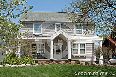 Tan Colonial House in Spring Stock Photo