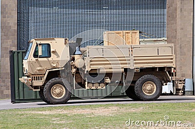 Tan Military Utility and Troop Carrier Diesel Vehicle Editorial Stock Photo