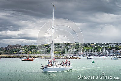 Tanagers learning how to sail. Group of people on a sailboat in Howth marina Editorial Stock Photo